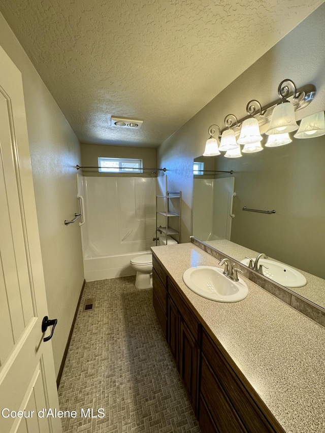 full bathroom featuring bathtub / shower combination, visible vents, toilet, vanity, and a textured ceiling