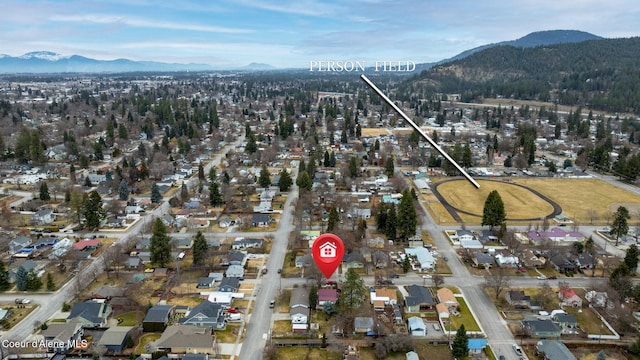 birds eye view of property featuring a mountain view