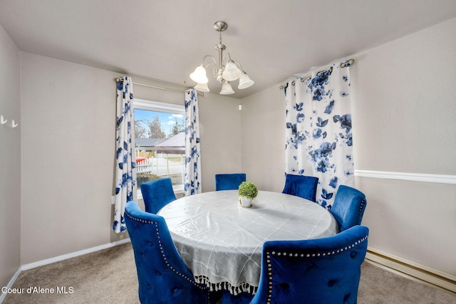 carpeted dining area with an inviting chandelier and baseboards