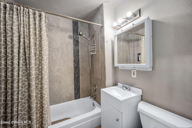 full bathroom featuring toilet, a textured wall, shower / bath combination with curtain, and vanity