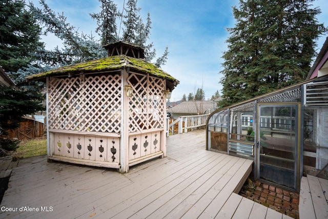 deck with a gazebo and fence