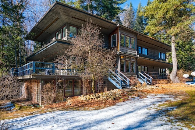 view of side of home with stairs