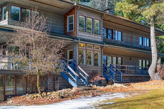 view of front facade with a porch and stairway