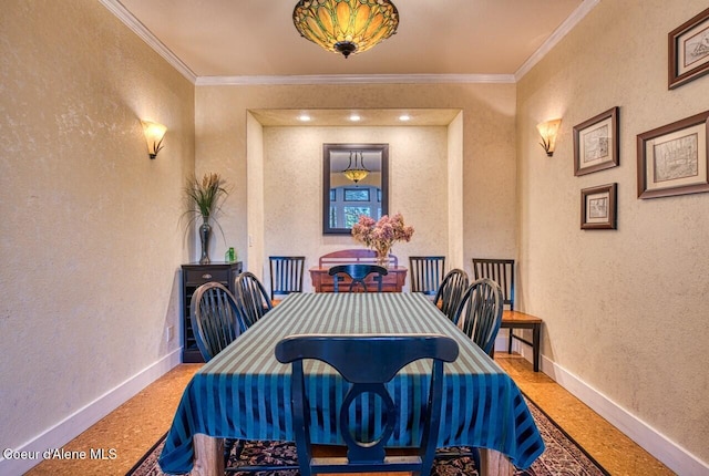 dining area featuring a textured wall and baseboards