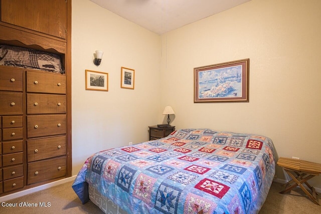 bedroom featuring carpet flooring and baseboards