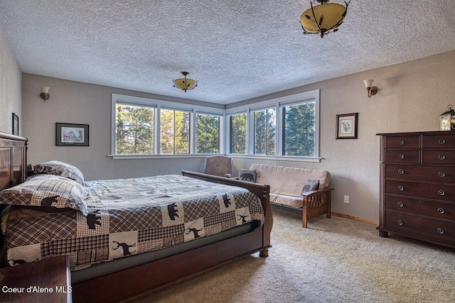 bedroom featuring multiple windows, a textured wall, carpet floors, and a textured ceiling