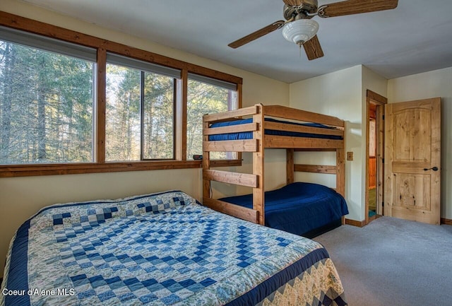 bedroom with ceiling fan and carpet