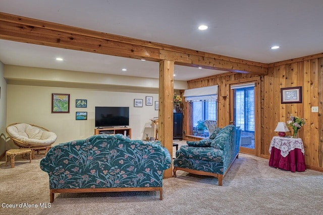 living room featuring carpet floors, wood walls, beam ceiling, and recessed lighting