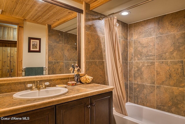 full bathroom with wooden ceiling, shower / tub combo with curtain, and vanity