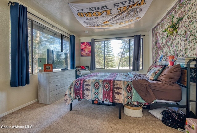 carpeted bedroom with baseboards