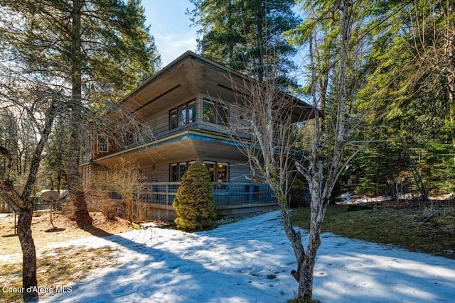 view of front facade with a balcony and a porch