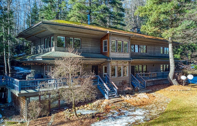 view of front of property featuring stairway