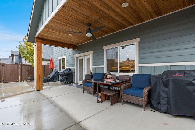 view of patio / terrace with french doors, grilling area, a gate, ceiling fan, and fence