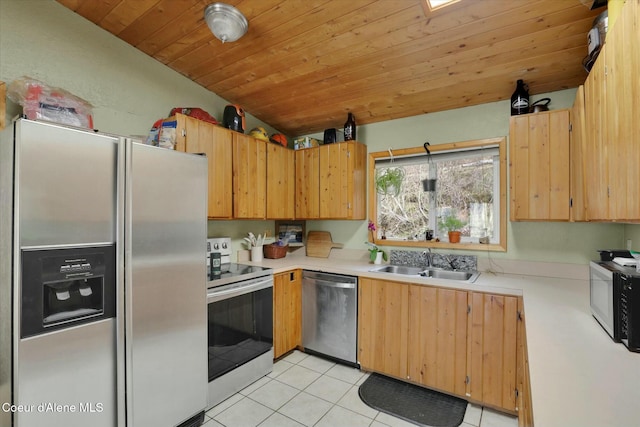 kitchen with light tile patterned floors, light countertops, appliances with stainless steel finishes, wood ceiling, and a sink