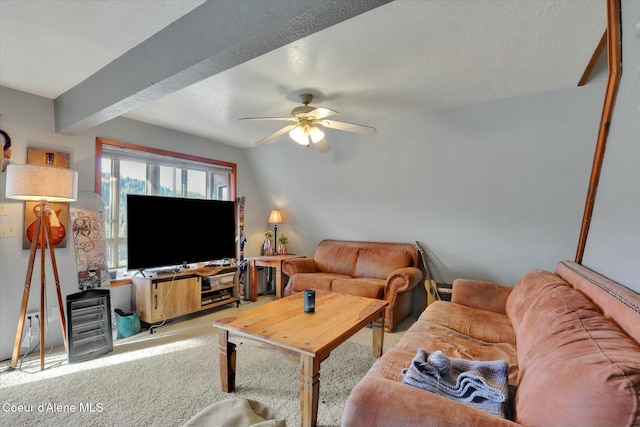 carpeted living room with a ceiling fan