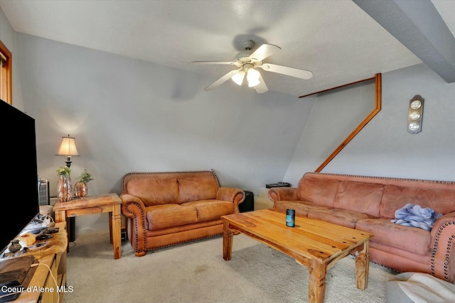 carpeted living area featuring a ceiling fan