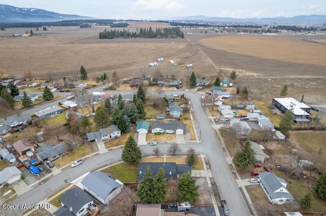 bird's eye view featuring a rural view and a mountain view