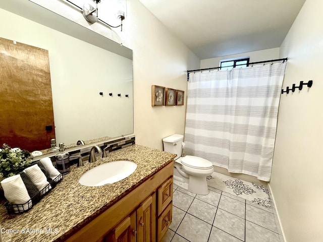 bathroom with a shower with shower curtain, vanity, toilet, and tile patterned floors