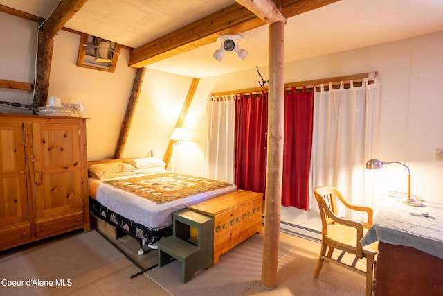 bedroom featuring beamed ceiling and a baseboard radiator