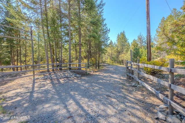 exterior space with a wooded view