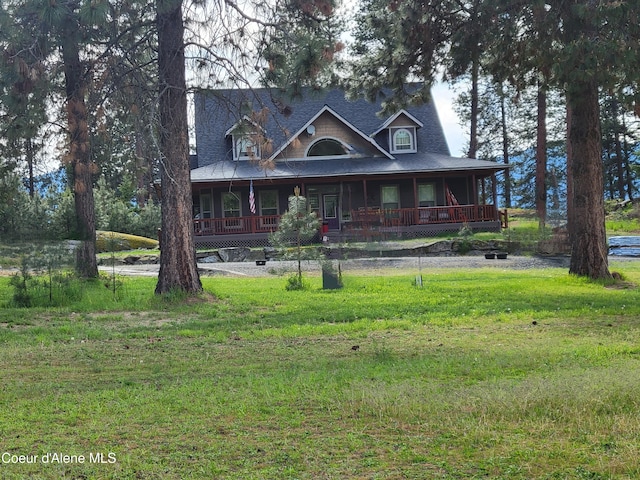 farmhouse inspired home featuring a porch and a front yard