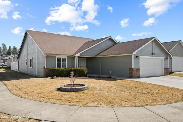 single story home featuring driveway, stone siding, a shingled roof, a front yard, and an attached garage