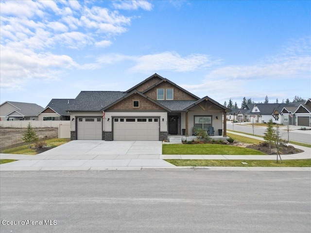 craftsman-style home featuring concrete driveway, a residential view, an attached garage, fence, and a front yard