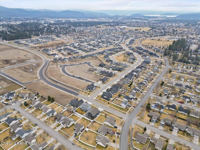 drone / aerial view featuring a residential view and a mountain view