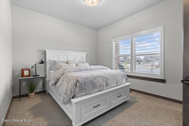 bedroom with carpet floors and baseboards