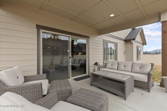 view of patio with an outdoor hangout area and fence