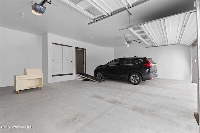 garage featuring a garage door opener