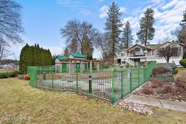 exterior space featuring a fenced front yard and a front yard