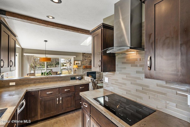 kitchen with dark brown cabinetry, wall chimney exhaust hood, beam ceiling, black electric cooktop, and backsplash