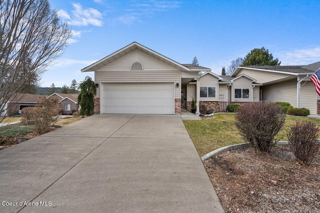 ranch-style home featuring a garage, a front yard, and concrete driveway