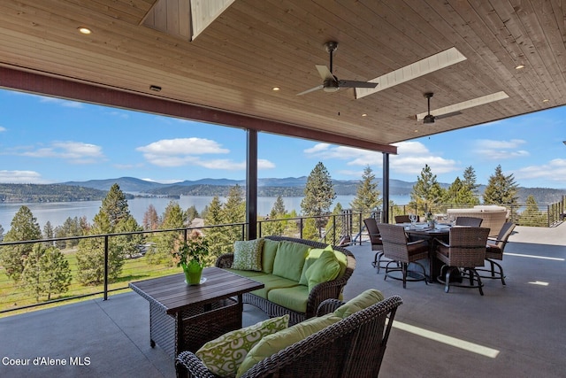 2766 S Helen Dr, Coeur Dalene, ID 83814 - view of patio / terrace featuring outdoor dining area, ceiling fan, an outdoor living space, and a water and mountain view