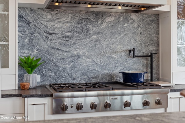 2766 S Helen Dr, Coeur Dalene, ID 83814 - details with stainless steel gas cooktop, wall chimney exhaust hood, dark countertops, and white cabinetry