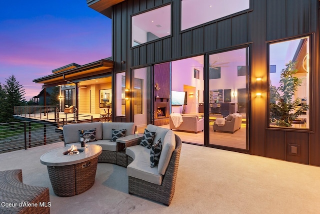 2766 S Helen Dr, Coeur Dalene, ID 83814 - patio terrace at dusk featuring an outdoor living space with a fire pit