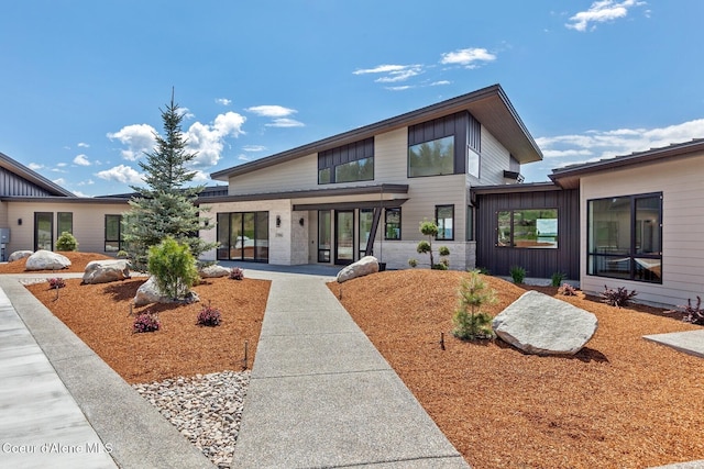 2766 S Helen Dr, Coeur Dalene, ID 83814 - view of front of home featuring board and batten siding and stone siding