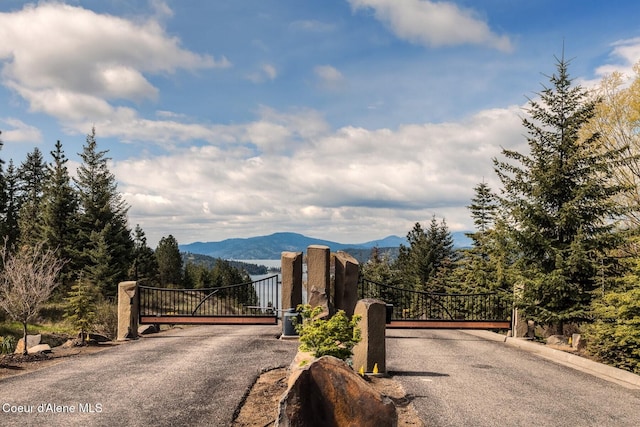 2766 S Helen Dr, Coeur Dalene, ID 83814 - view of street featuring a mountain view and a gate