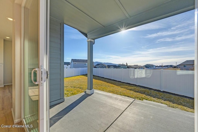 view of patio featuring fence