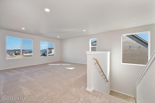 carpeted spare room with baseboards and recessed lighting