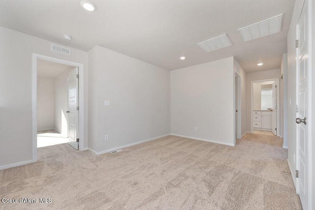 interior space with light carpet, baseboards, visible vents, and recessed lighting