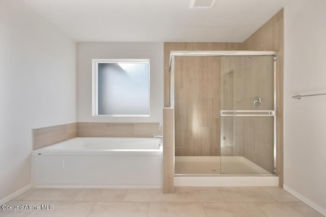 bathroom featuring tile patterned flooring, visible vents, a shower stall, and a bath