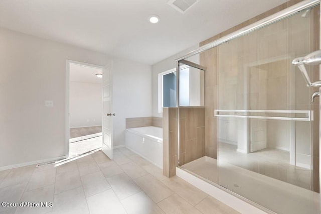 full bathroom featuring a stall shower, tile patterned flooring, visible vents, and a garden tub