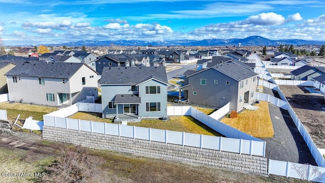 birds eye view of property featuring a mountain view and a residential view