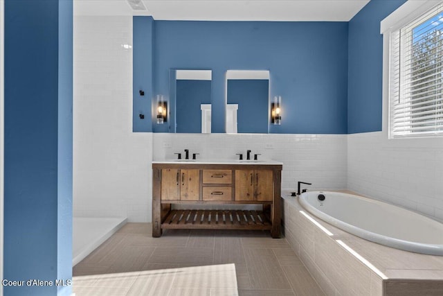 bathroom featuring double vanity, a sink, and a garden tub
