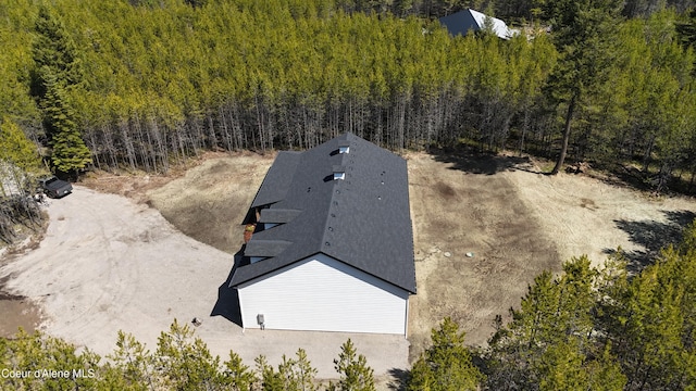 drone / aerial view with a view of trees