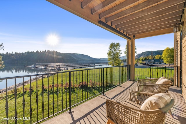 balcony with a water and mountain view