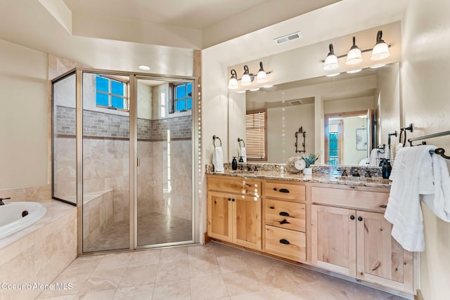 full bath with double vanity, a stall shower, a garden tub, and visible vents