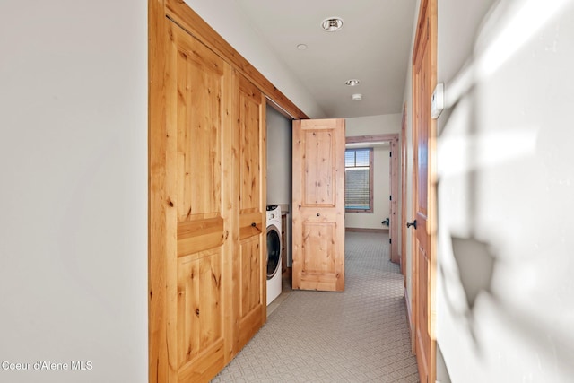 hallway with washer / clothes dryer